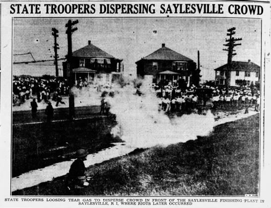 Large crowd of people disperse as cloud of white smoke rises in the center of the photo