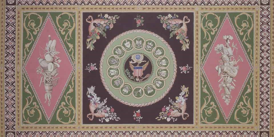 Illustration of elaborate carpet with central medallion featuring the Great Seal of the U.S.