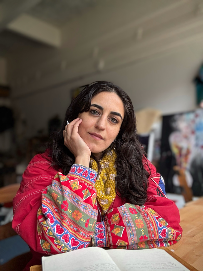 Woman wearing colorful traditional clothing with long dark wavy hair