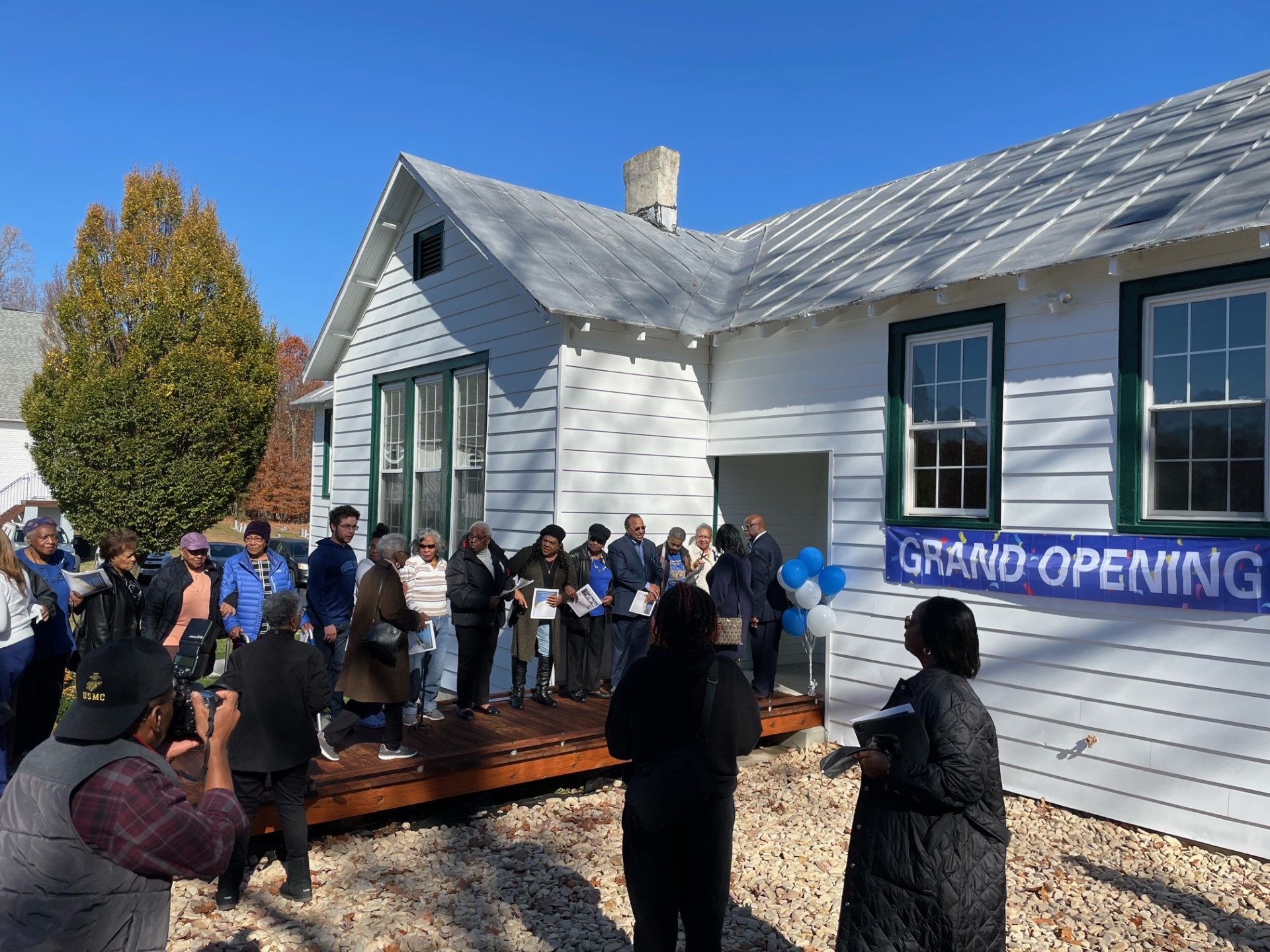 Crowd gathers for grand opening of St. John Rosenwald School community center.