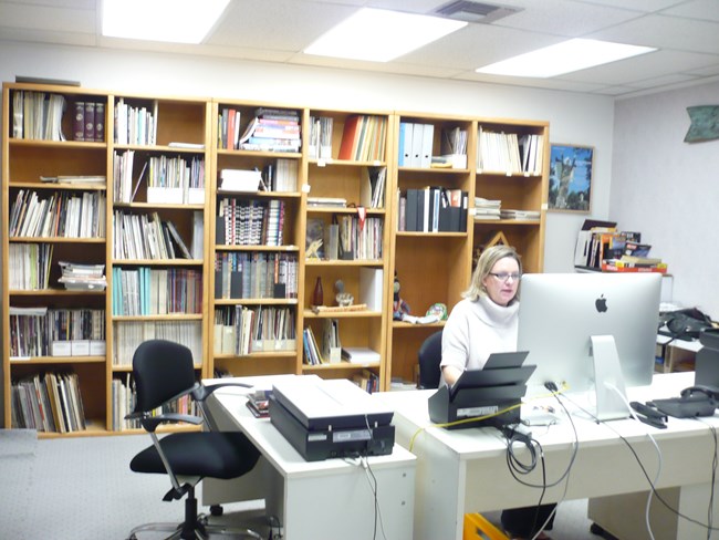 Stacy Mueller, archivist, working in the SPACES offices in Aptos, CA.