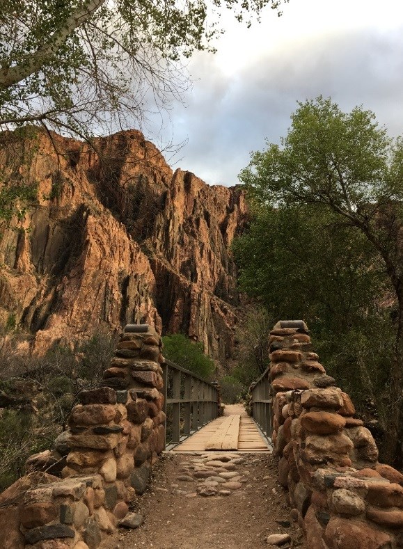 The Trans-Canyon Waterline runs beneath a trail bridge near Phantom Ranch in the inner canyon