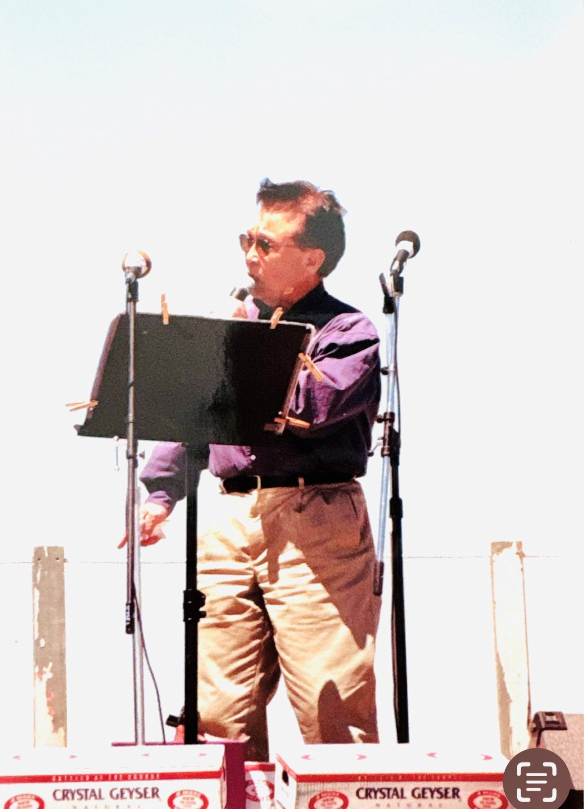A man standing on a stage giving a speech