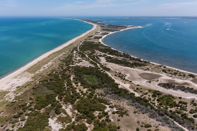 Aerial view of barrier island with ocean on either side.