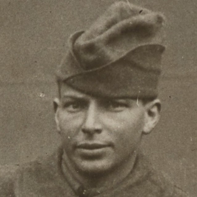 African American Soldier wearing World War One uniform looking at the camera