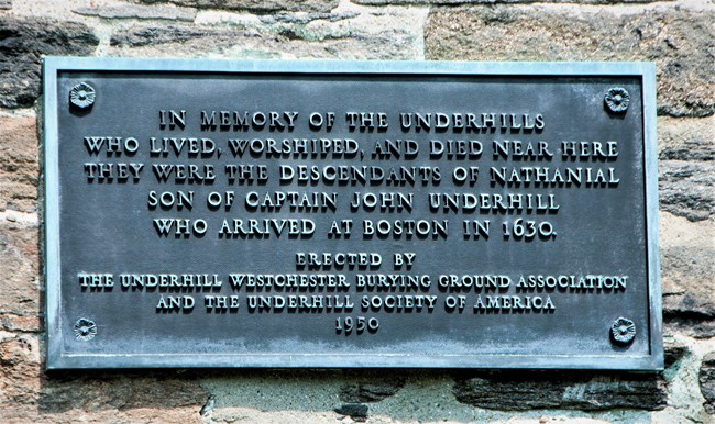 Metal plaque, set into a masonry wall