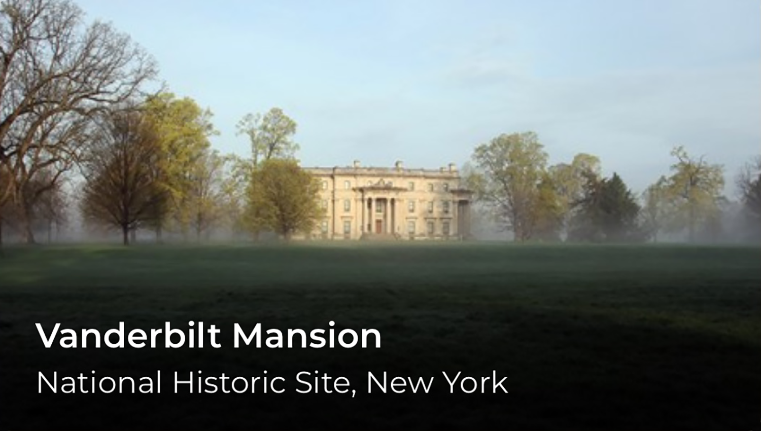 A mansion on a grassy field. Vanderbilt Mansion is written in the lower left.