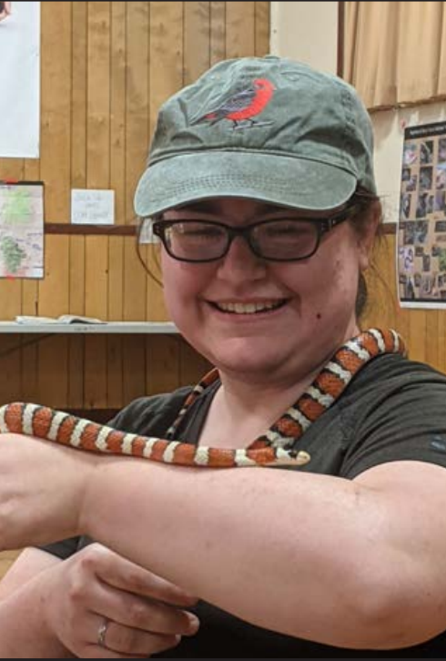 A BioBlitz participant visits with a kingsnake  up close.