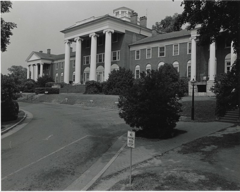 Black and white photograph of the main building and parking lot of the Western State Hospital Complex.