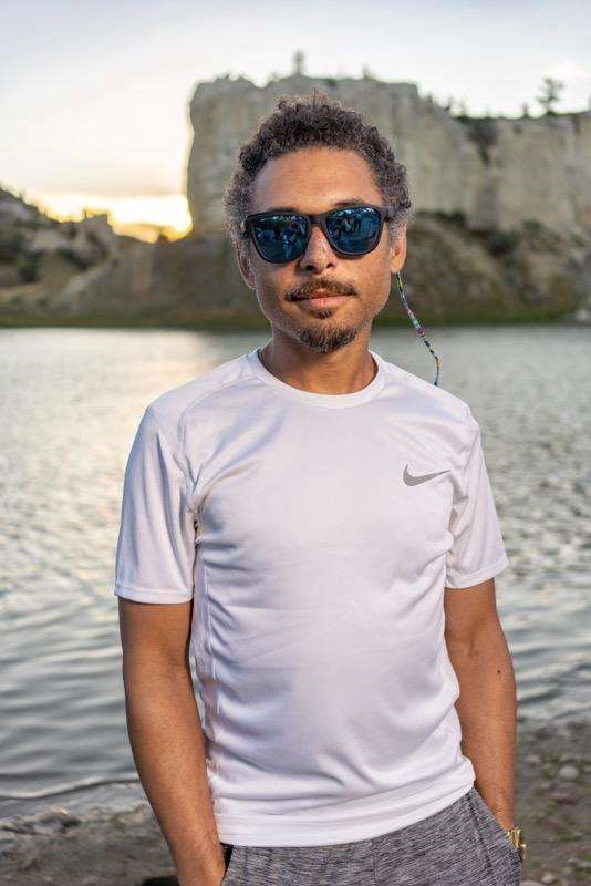 a black man wearing a white tshirt