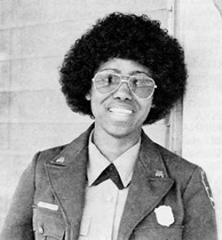 Black and white photo of Audrey Calhoun in her Park Service Uniform but without a hat.