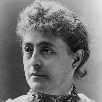 close up photo of a woman with short brown hair