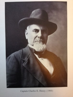 oldee gentleman wearing a suit and vest also is wearing a hat on his head amd has a white goatee