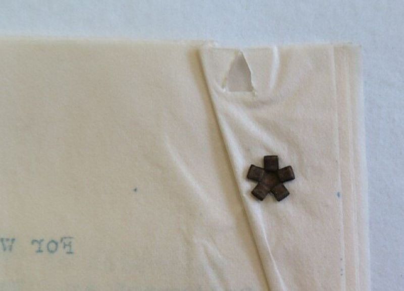 Grommet fastener used in archives.