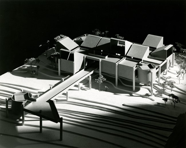 Architectural model of West Beach Bath House; modular structure surrounded by trees.