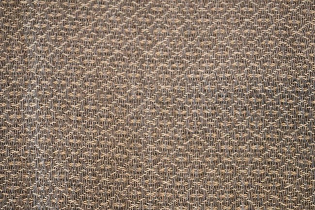 Close up photo of fabric with a woven diamond design
