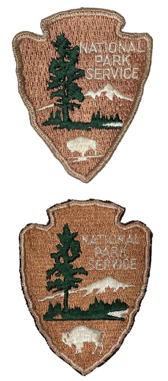 Two tan arrowhead shaped patches