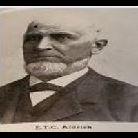 black and white photo of a man with a white  beard