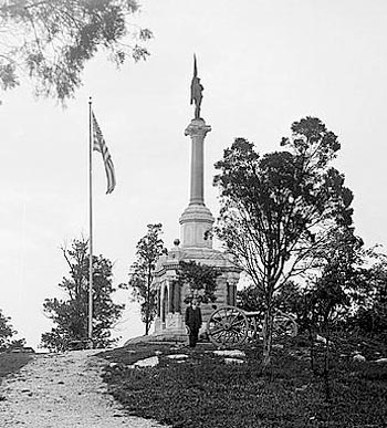 Black and white image of a Civil War veteran at Gettysburg monument