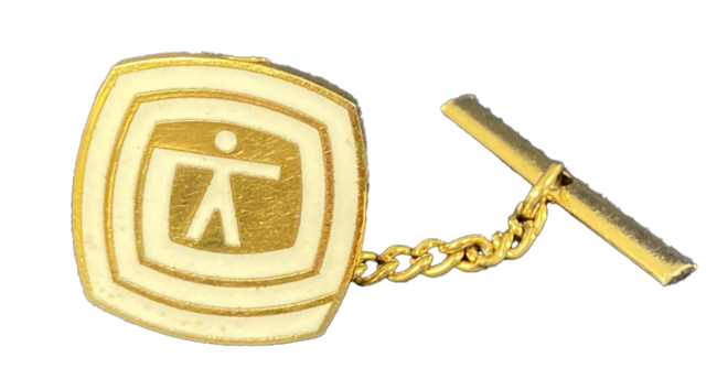 Gold tie tack with white Environman symbol