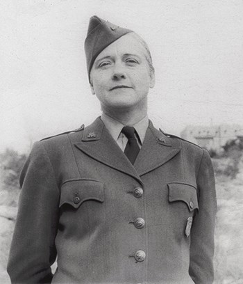 Viola Shannon at Carlsbad Caverns National Park, wearing a WAC-style coat with epaulettes her hair is tightly pulled back away from her face.