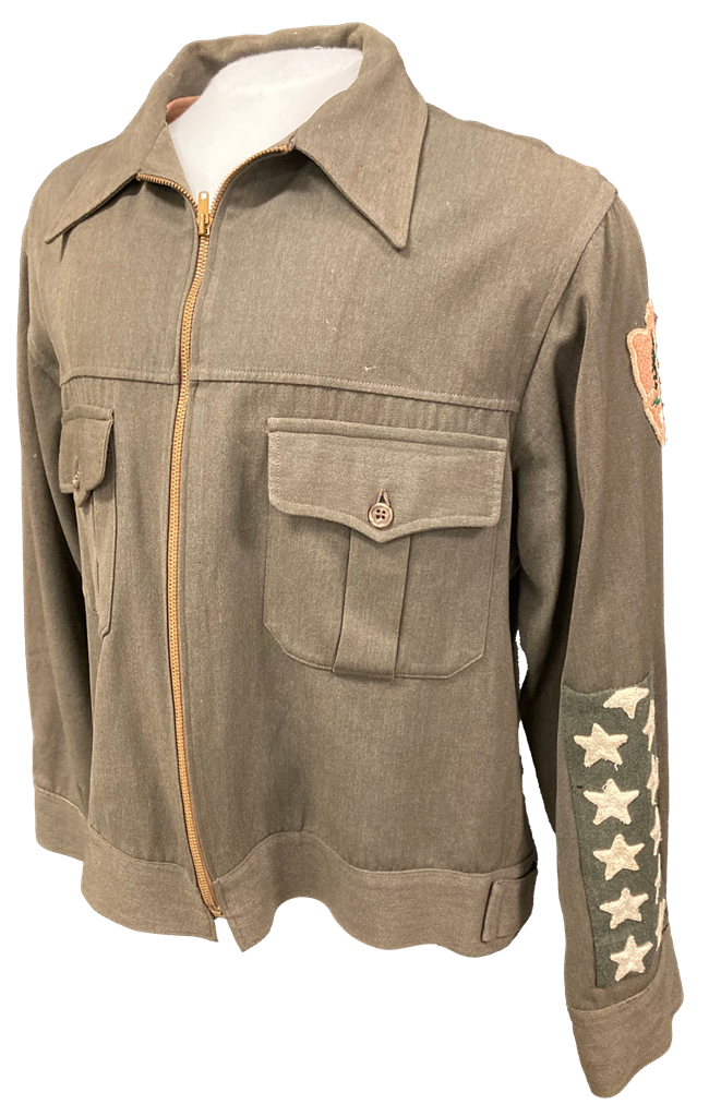 Green jacket with oversized stars on sleeve and arrowhead patch