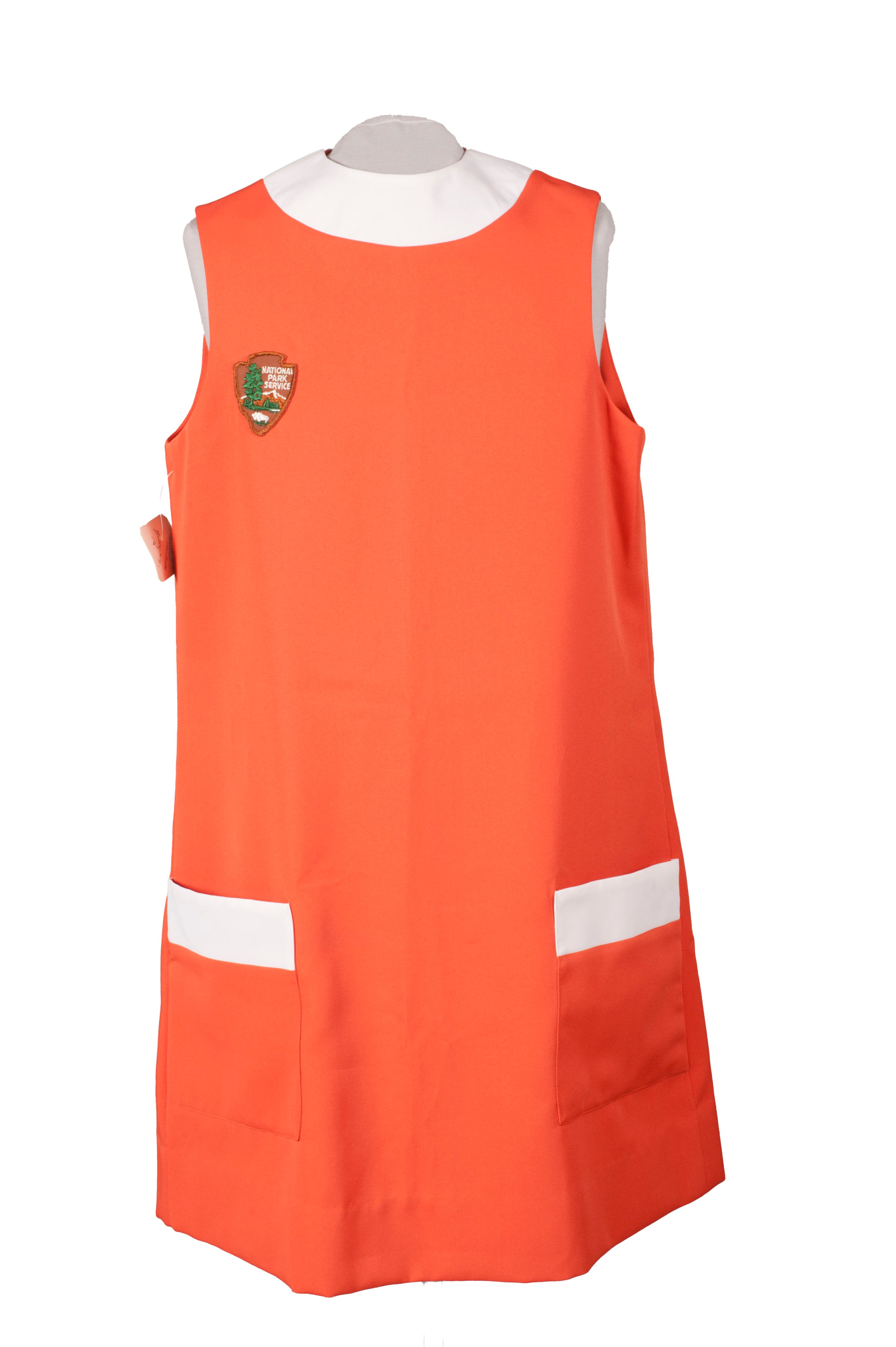 orange smock with white trim shown on a mannequin