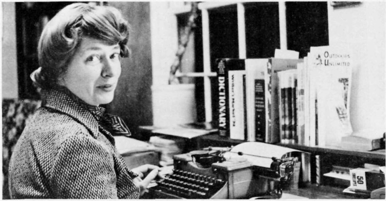 Dorothy Huyck sitting at her typewritter