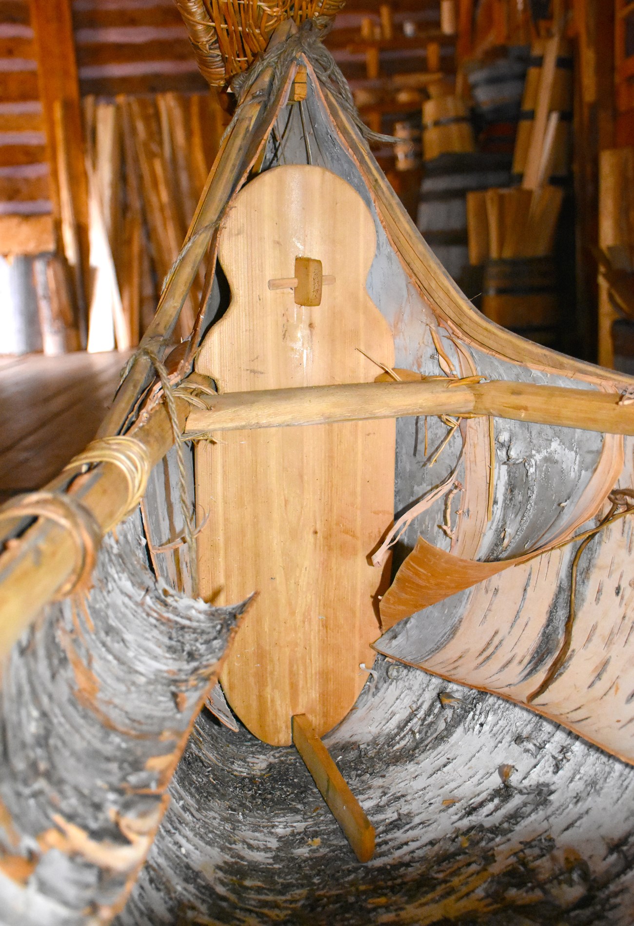 A shaped board in the inner end of a birch bark canoe.