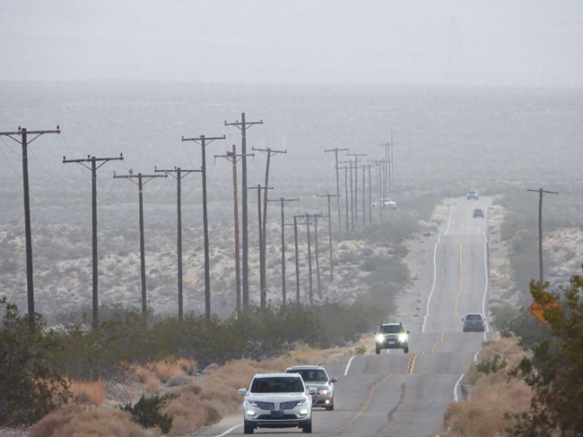 cars along Kelbaker Road during a rainstorm