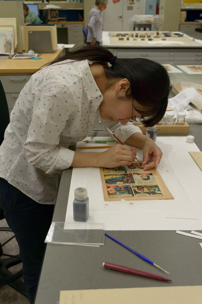 Michiko Adachi applying test mends to King of the Royal Mounted.