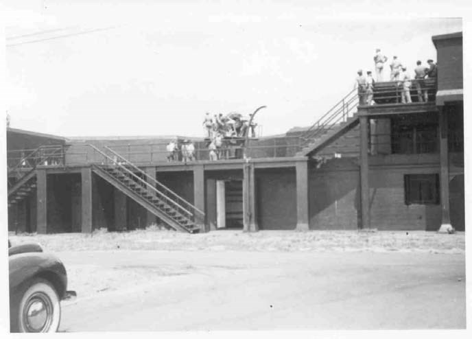 a group of soldiers stand on top of a historic battery