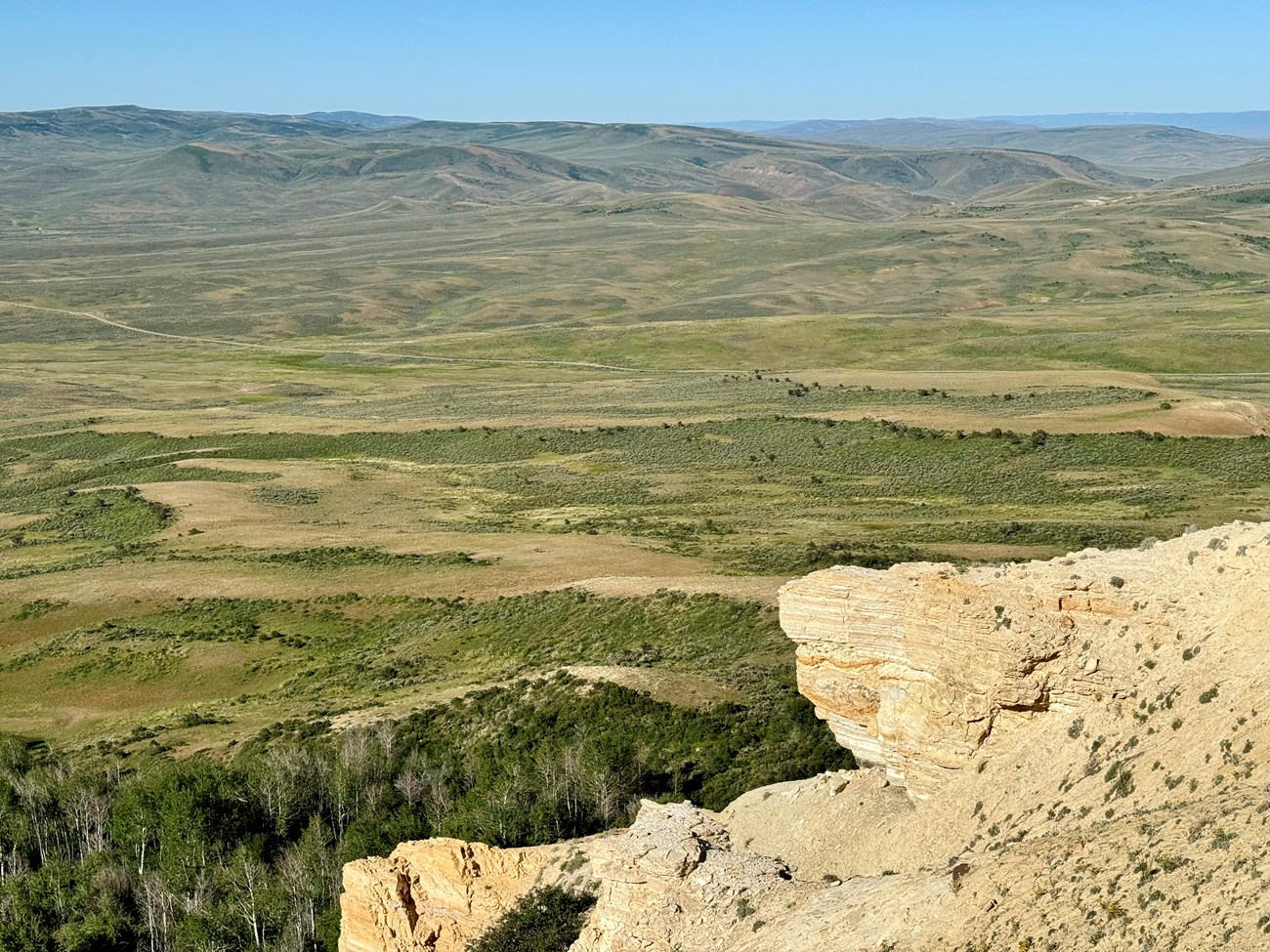 Sagebrush steppe and sandstone outcrop viewed from a high point at Fossil Butte National Monument.