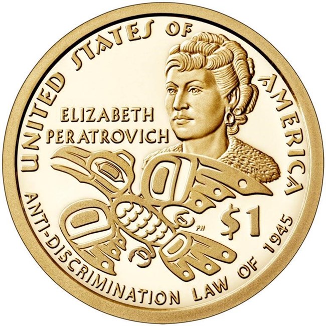 a gold coin with a raven emblem, etching of a woman's face and words elizabeth peratrovich anti-discrimination law of 1945