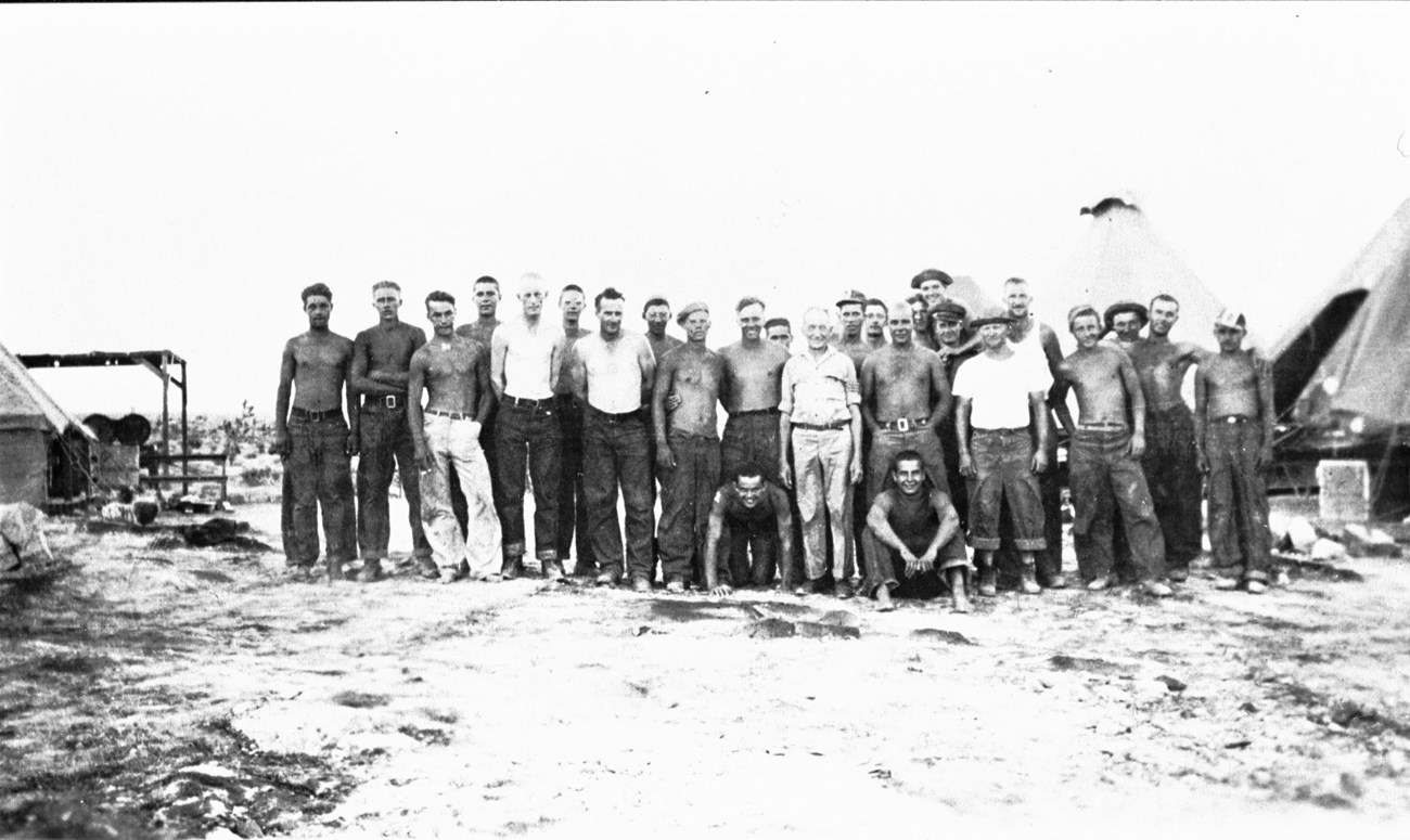 Black and white historic photo of a group of people standing together.