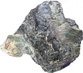 a chunk of grey-green rock on a white background