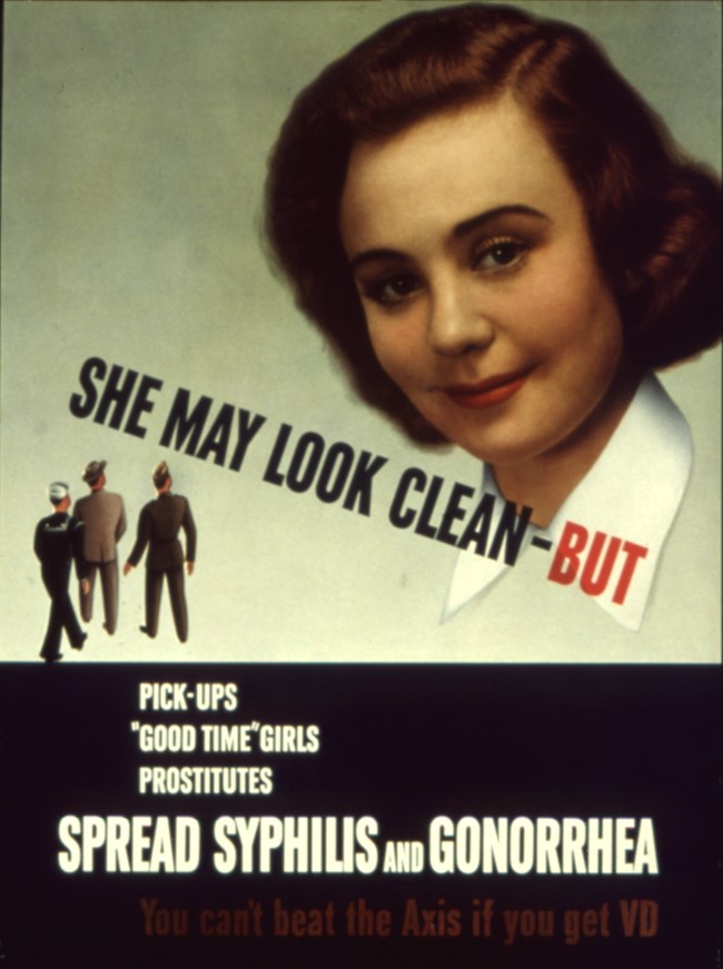 Large face of brunette woman with small male figures in the low left corner and the words "She May Look Clean-But"