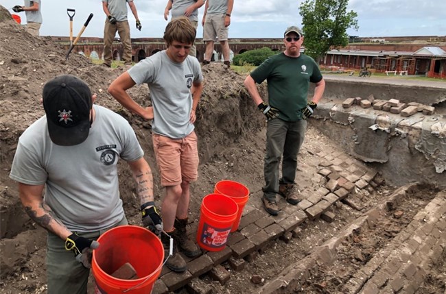 Young Men working on fort water system