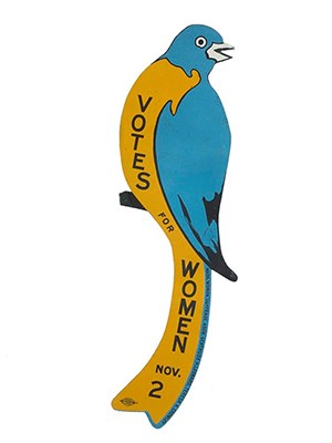 Blue and gold colored bluebird-shaped sign calling for woman suffrage