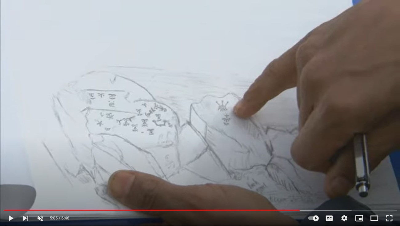 Screen capture from “The Appearing and Disappearing Petroglyphs of Cape Alitak"