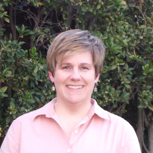 headshot of smiling woman with short blonde hair