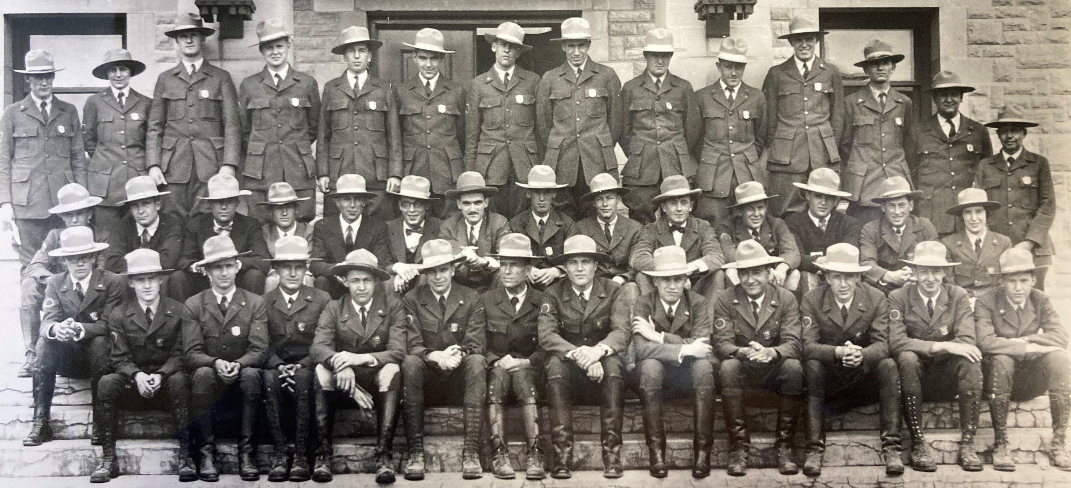 Group of rangers in uniform pose for photo