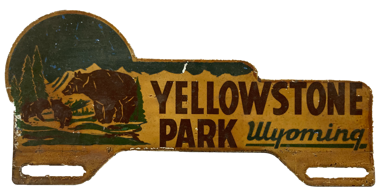 metal plate painted with bear scene and Yellowstone Park