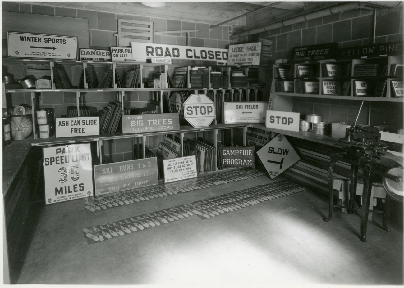 View into a room stacked with different kinds of road signs