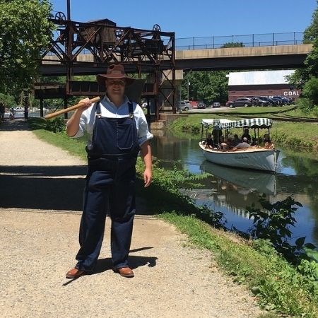 Youth crew member in Canal Period clothing.