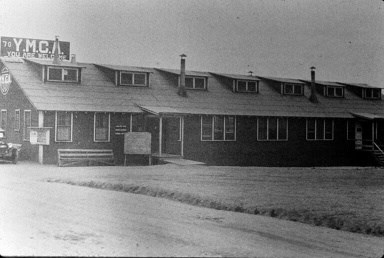 A large building with a YMCA sign on top