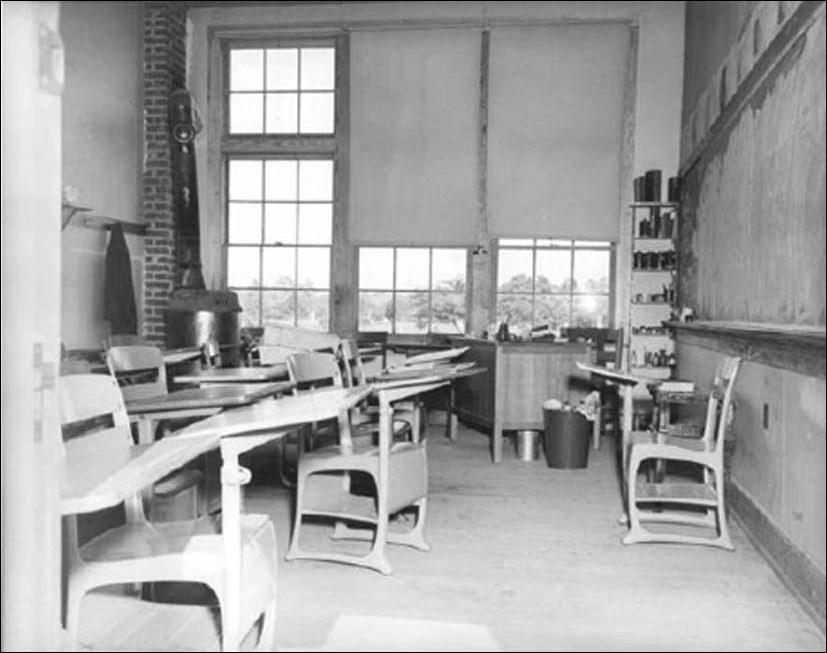 Photo of interior of classroom with desks and chalkboard. (Courtesy of the National Archives and Records Administration)