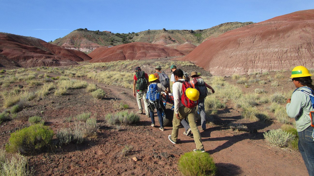 group of youth hike desert trail