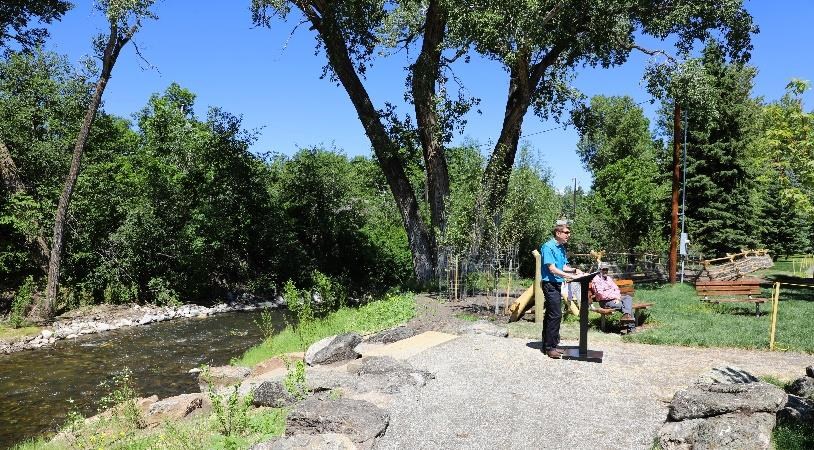 Mitch Overton giving a speech celebrating the newly restored creek during the ribbon-cutting ceremony. Photo courtesy of Mitch Overton, City of Bozeman.