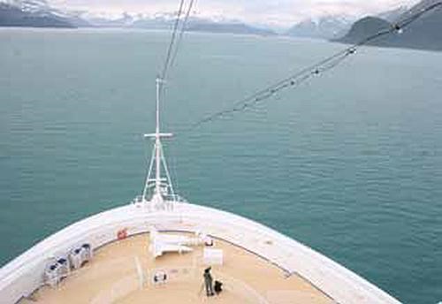 A whale observer  near the bow of a cruise ship
